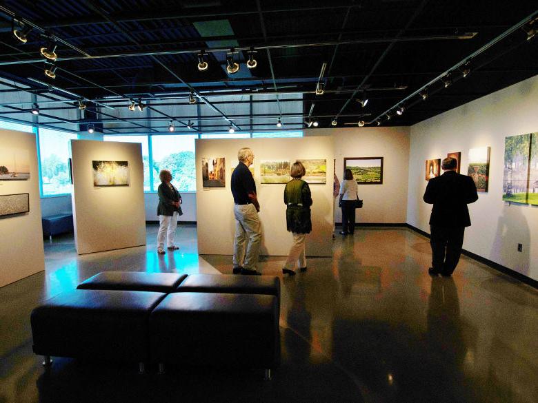 people enjoying artwork in the ronald k. de long gallery